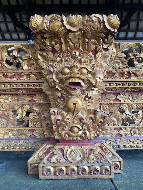 A close up of a door with a gold and red design.