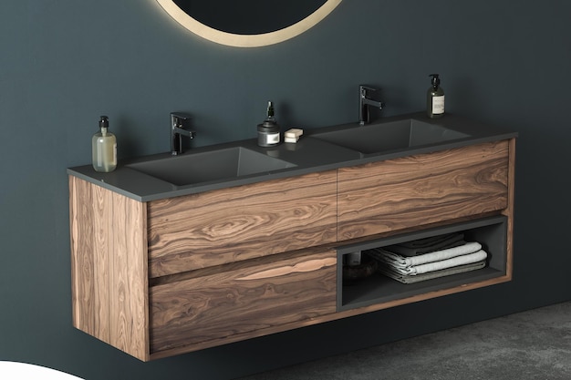 Photo close up of double sink with oval mirrors- hanging in on dark blue wall, cabinet with chrome faucet.