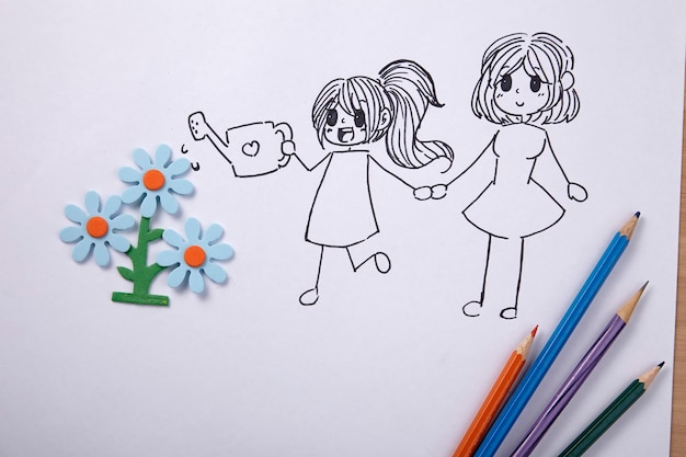 close-up of drawings on white paper with crayons