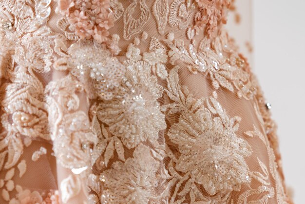 A close up of a dress with flowers on it