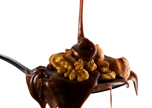 Photo close-up of dried fruit and chocolate against white background