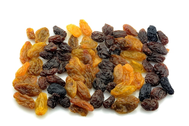 Close-up of dried fruits over white background