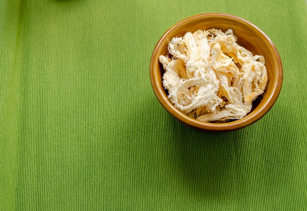 Close up in dried squid on green  background