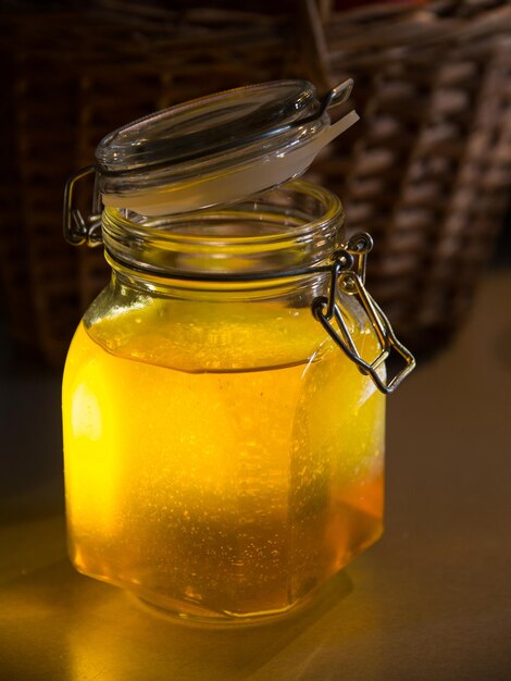 Close-up of drink in glass jar on table