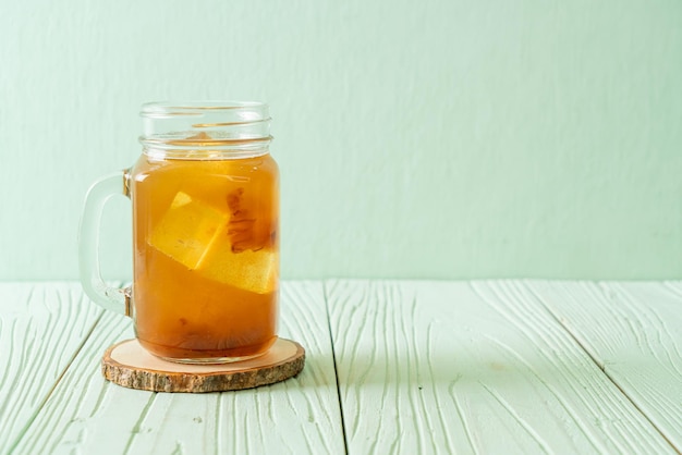 Close-up of drink in glass jar on table