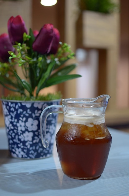 Close-up of drink in glass jar on table