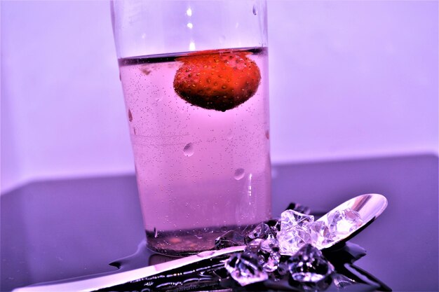 Close-up of drink on glass table