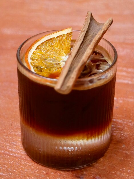 Photo close-up of drink  orange americano on table