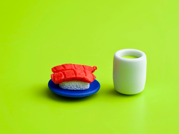 Close-up of drink on table against green background