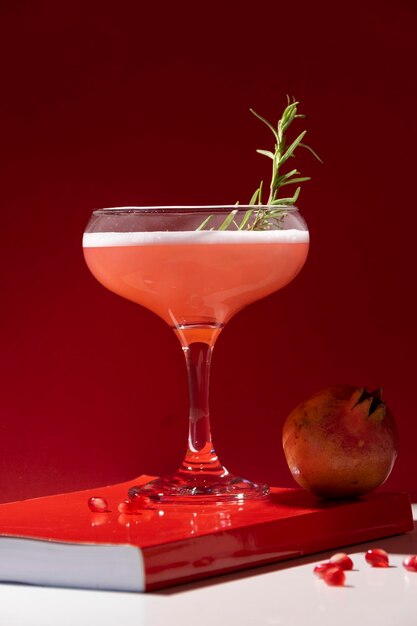 Close-up of drink on table against red background