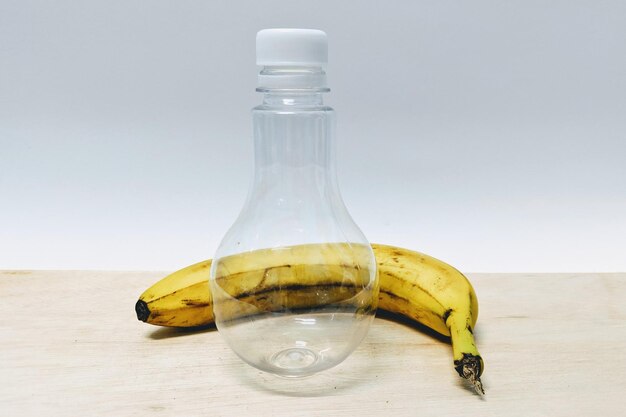 Close-up of drink on table against white background