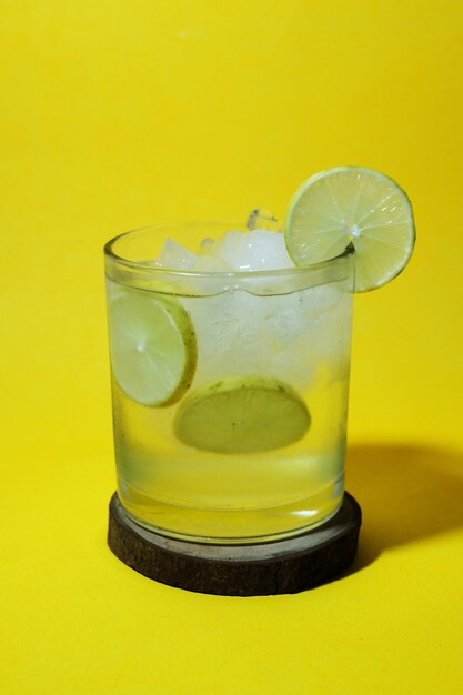 Close-up of drink on yellow glass