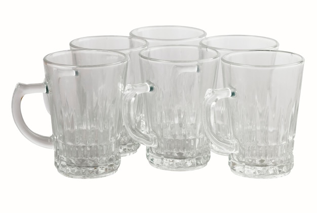 Photo close-up of drinking glasses against white background