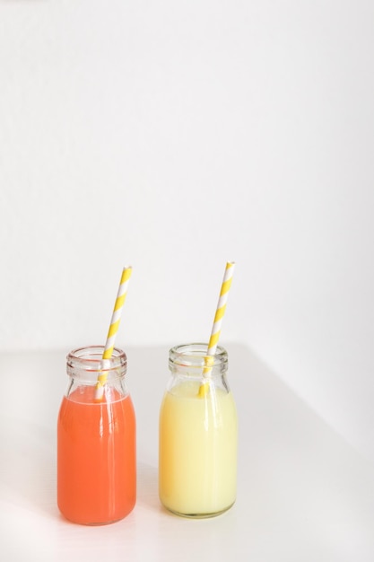 close-up of drinks on table against white background
