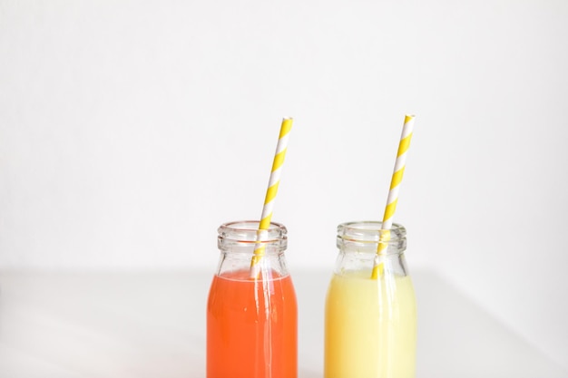 close-up of drinks on table against white background
