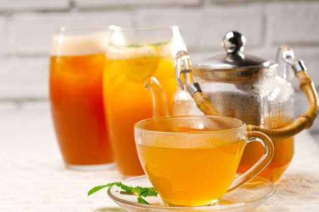 close-up of drinks with cup and teapot on table