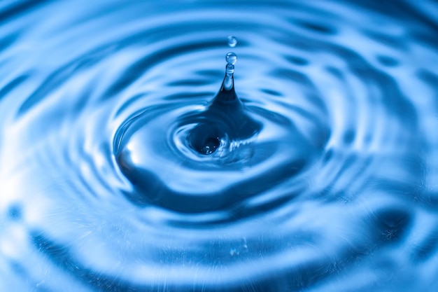 Close-up of drop falling in water