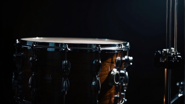 Photo close up of a drum set in dim light