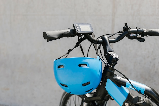 Close up e-bike with helmet on handlebar