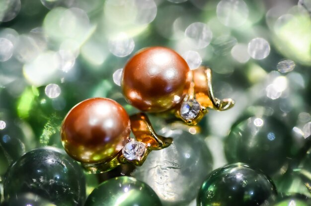 Close-up of earrings with diamond stones