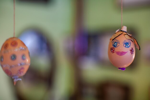 Close-up of easter eggs hanging at home