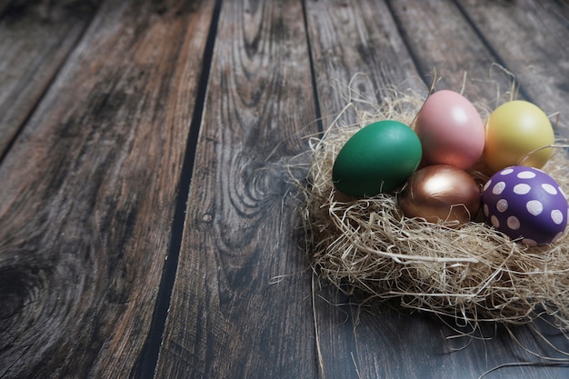 Close up Easter eggs on wooden table.