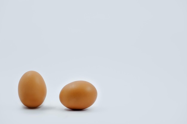 Close-up of eggs against white background