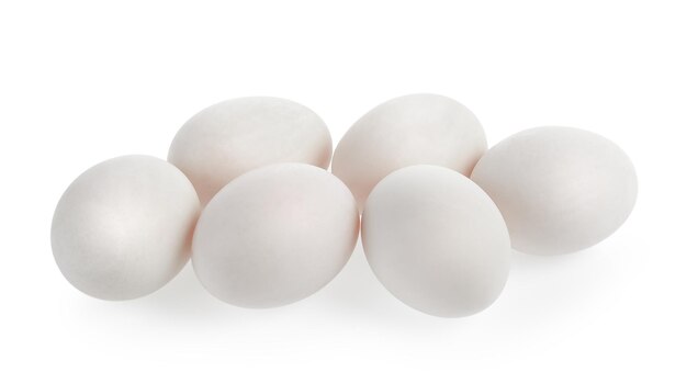 Photo close-up of eggs against white background