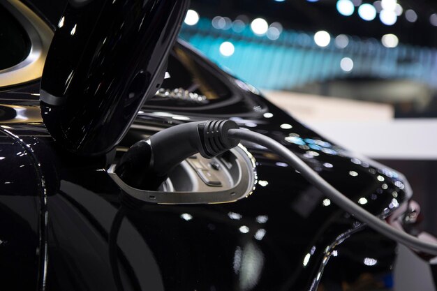 Close-up electric car at electric vehicle charging station