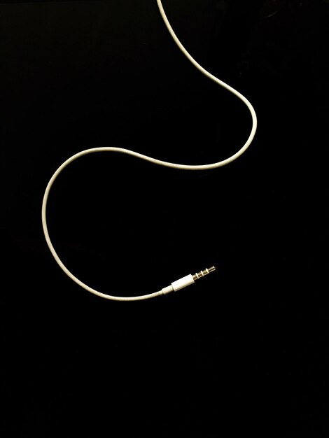 Photo close-up of electric plug on black background