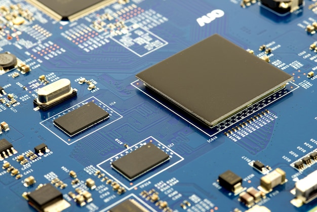 close-up of electronic circuit board with processor background