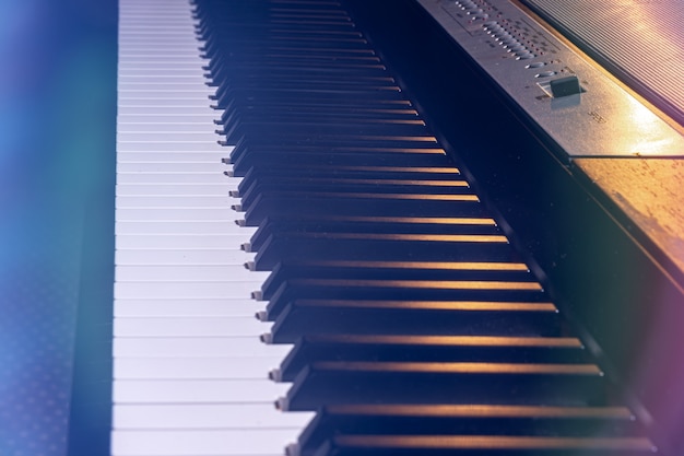 Close-up of an electronic piano keyboard in beautiful lighting.