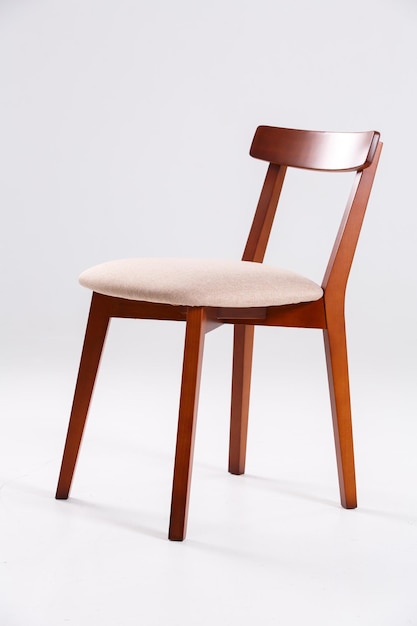 close-up of empty chair on table against white background