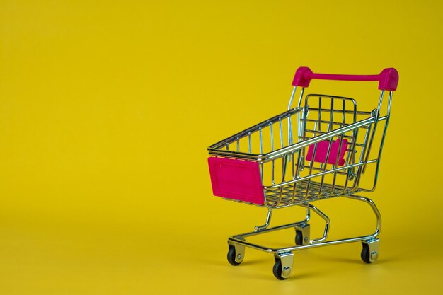 Close-up of empty chairs against yellow background