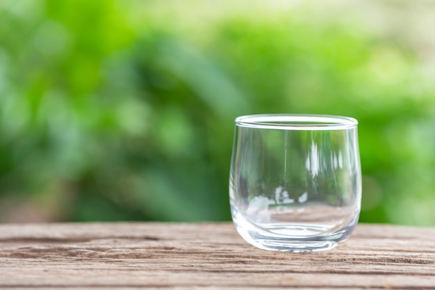 Close up empty drinking glass on wooden table