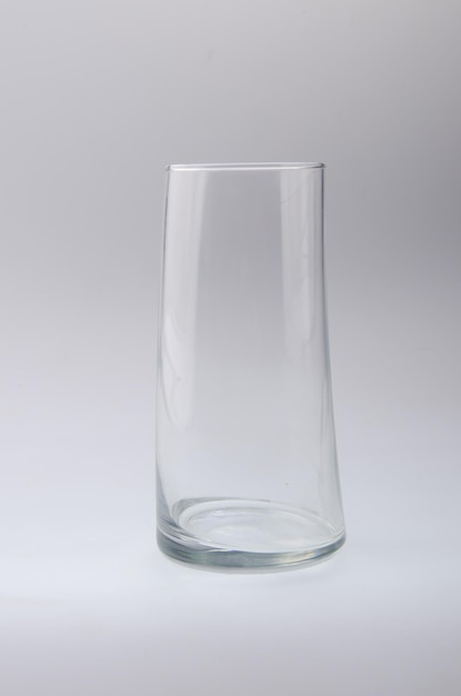 Close-up of empty glass against gray background