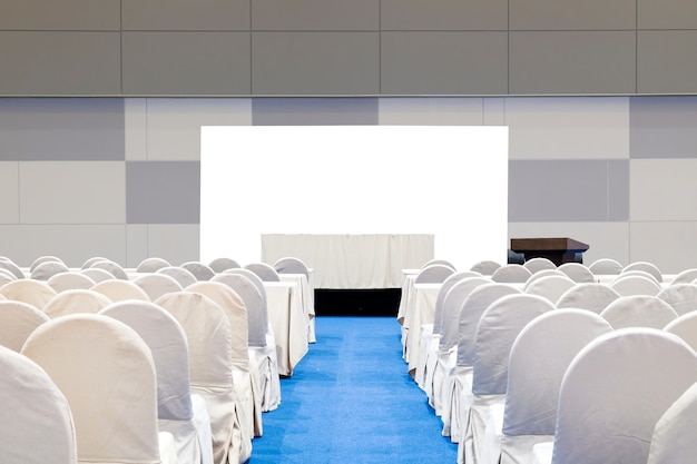 Photo close-up empty meeting room with stage, table, isolated on white background