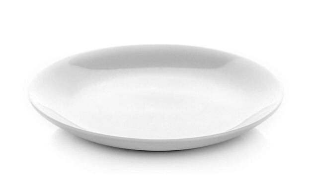 Close-up of empty plate against white background