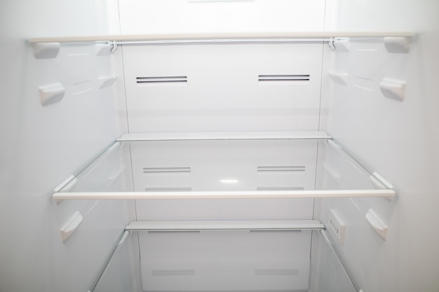 Close up of empty refrigerator shelves