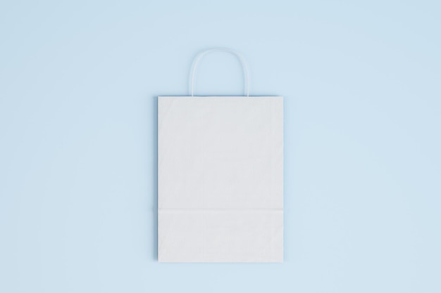Foto close up di una borsa di carta bianca vuota su sfondo blu concetto di acquisto mock up rendering 3d