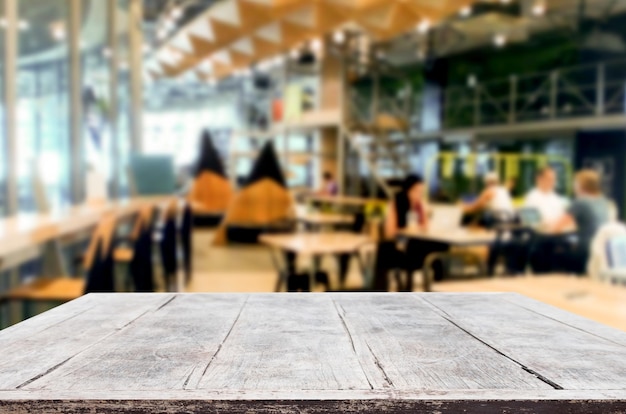 Close-up of empty wooden table in cafe