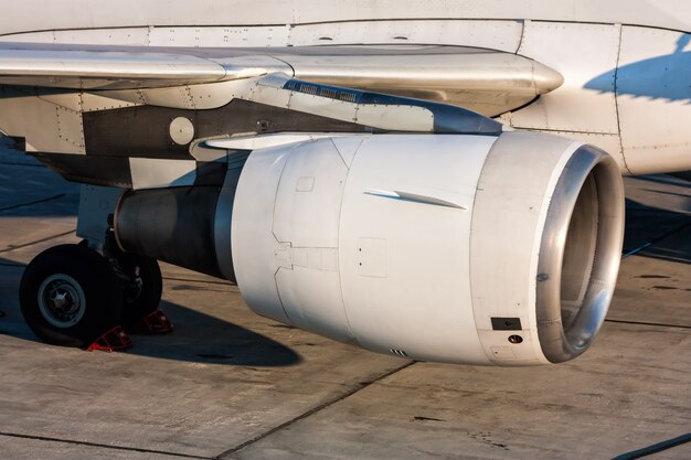 Close-up of engine and main landing gear of passenger aircraft