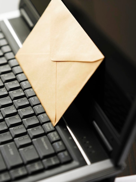 Close-up of envelope on laptop
