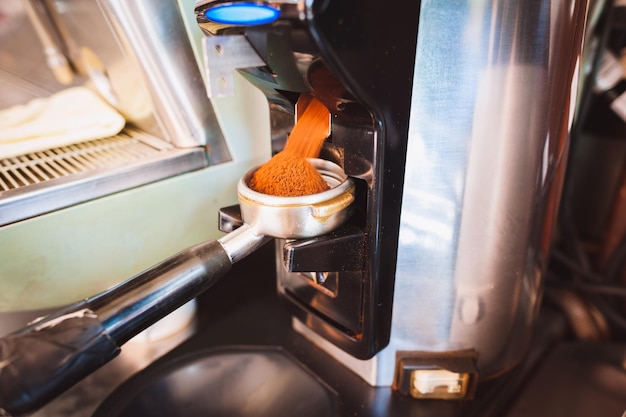 Photo close up of espresso grounds in machine