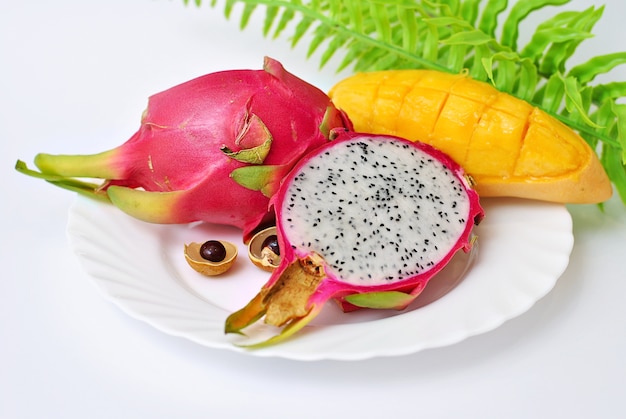 Close up on exotic dragon fruit with mango sliced