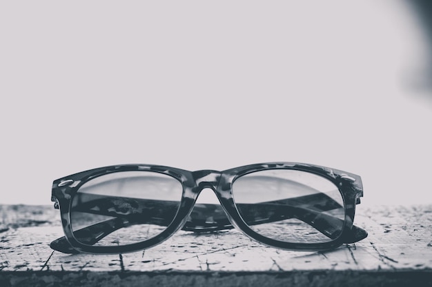 close-up of eyeglasses against white background