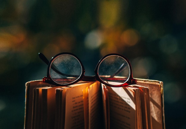 Photo close-up of eyeglasses on book