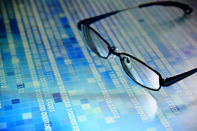 Close-up of eyeglasses on paper