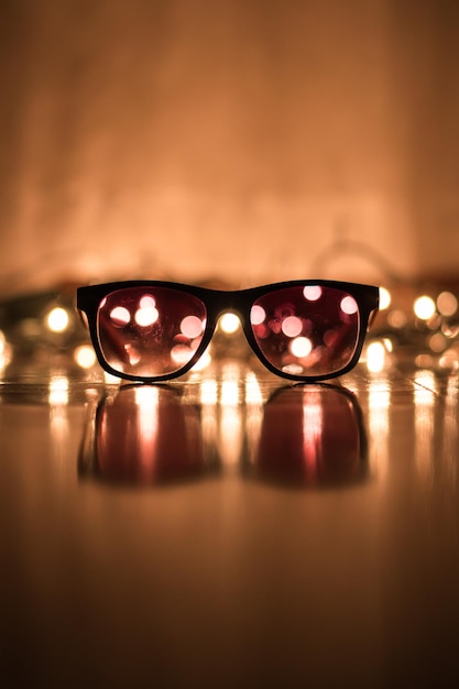 Photo close-up of eyeglasses on table