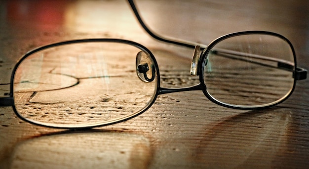 Photo close-up of eyeglasses on table